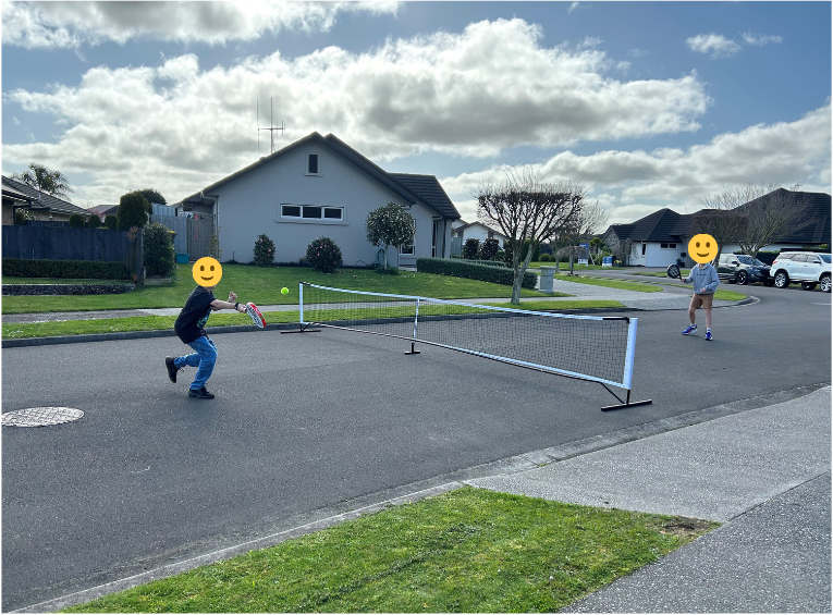 Kids playing padel tennis on the road having fun